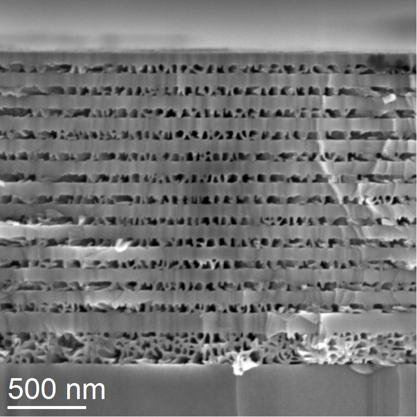A scanning electron microscope (SEM) image of a DBR made up of alternating layers of porous and non-porous GaN