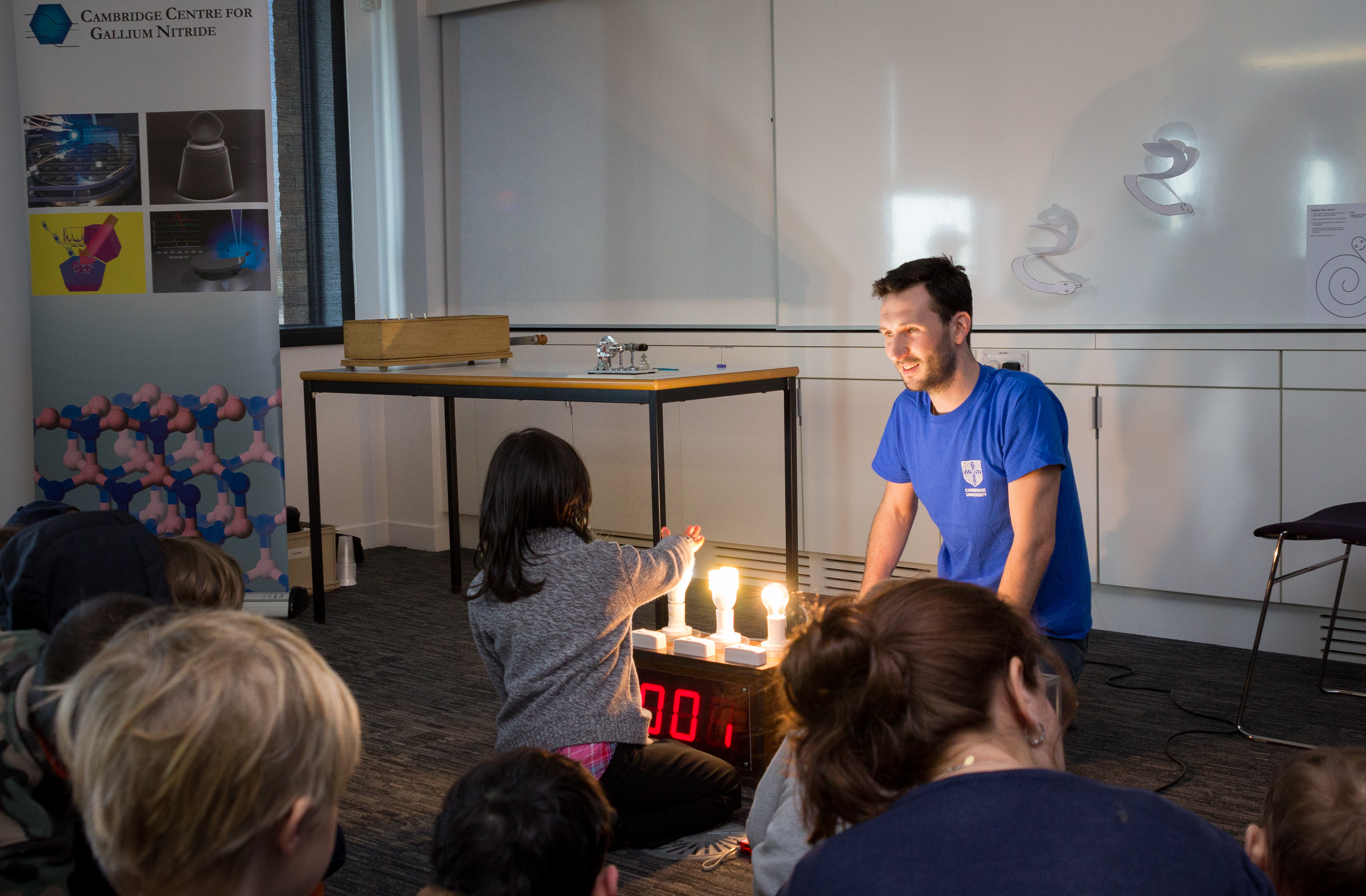 Fabien explains how we can feel the wasted energy of an inefficient light bulb as heat. (Credit: John Jarman)