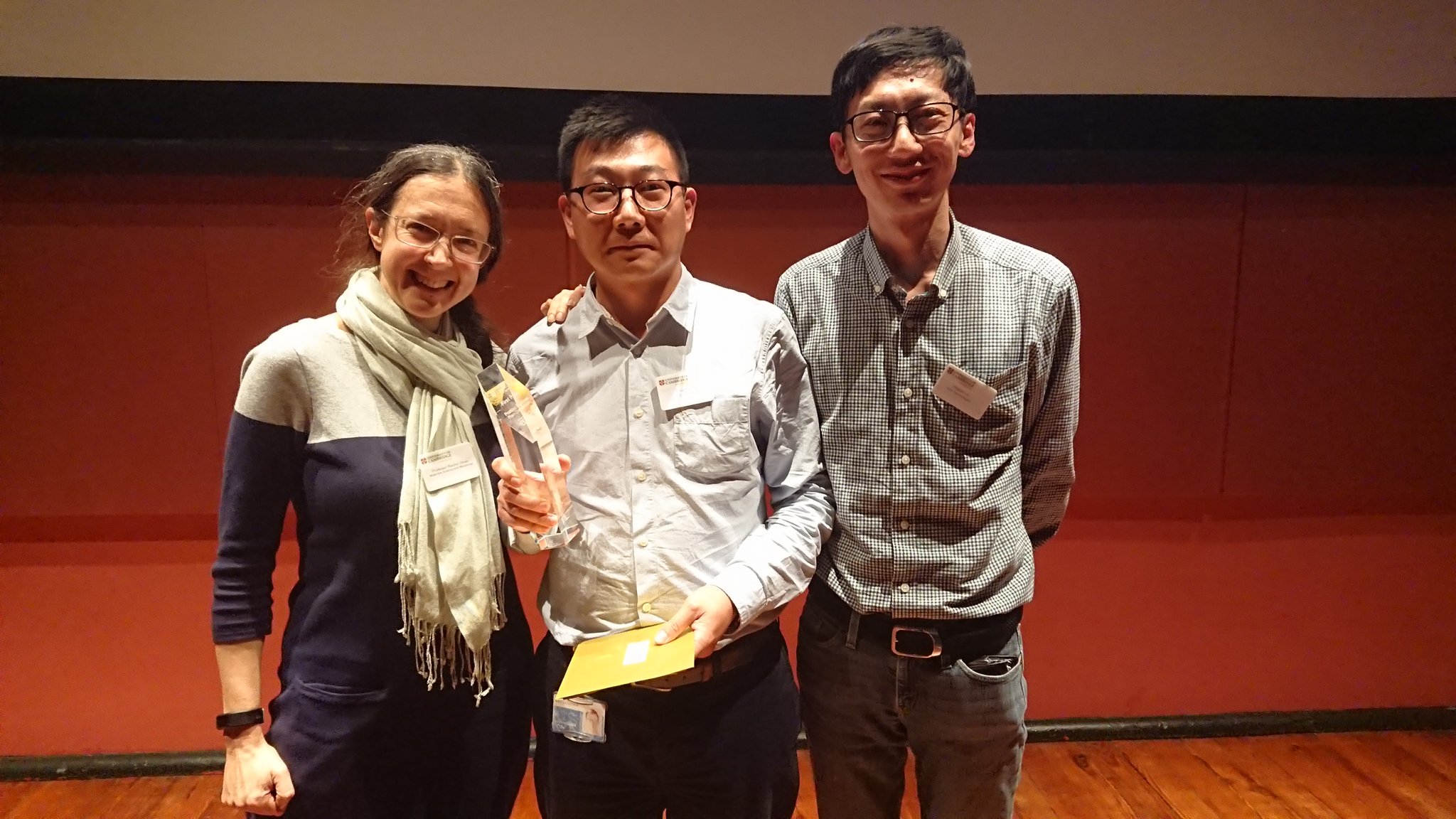 The three officers of Poro Technologies with the award. From left to right: Rachel Oliver, Tongtong Zhu and Yingjun Liu.